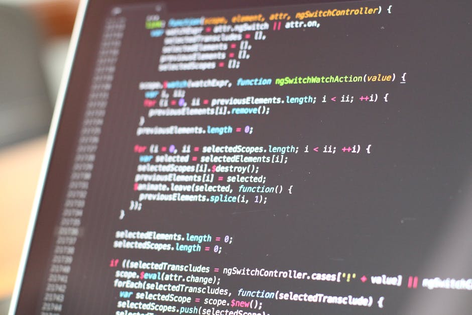 A close-up photograph of a computer screen displaying lines of colorful programming code. The code includes various CSS styling elements, such as properties for margins, borders, shadows, background c